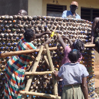 Butakoola Village Association for Development (BUVAD) an NGO based in Uganda builds rain water harvesting tanks using waste plastic bottles as b...